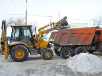 Услуги по уборке снега погрузчиком с территории школ и детских садов